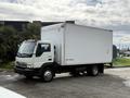 A 2008 International CityStar truck with a white cargo box and an extended cab parked on a concrete surface