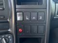 The image shows a control panel from a 2007 GMC C4500 TopKick featuring various buttons and switches including a red switch and several blank rectangular buttons