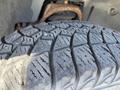 Close-up of a tire tread on a 2013 Chevrolet Silverado 1500 showcasing detailed patterns and grooves designed for traction