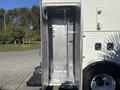 The image shows the open metal compartment of a 2008 International 4400 truck with a textured floor and a mesh panel on one side