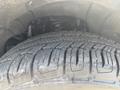 Close-up of a tire tread on a 2017 Chevrolet Colorado showcasing deep grooves and a sturdy design