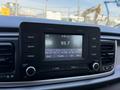A dashboard display of a 2018 Kia Rio5 showing a radio tuner tuned to FM 93.7 with various control buttons and a touchscreen interface