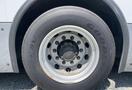 Close-up of a tire on a 2017 Grande West Vicinity bus showing a steel rim with multiple bolts and a tread pattern labeled Good Year
