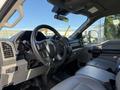 Interior view of a 2020 Ford F-550 with a focus on the steering wheel dashboard and front seats