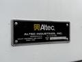 A plaque displaying the logo of Altec Industries Inc with details about utility equipment and bodies including a phone number and serial number