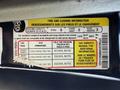A tire and loading information label from a 2011 Ford Econoline detailing seating capacity tire dimensions and cold tire pressure values
