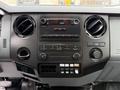 Interior dashboard of a 2016 Ford F-550 Super Duty featuring audio controls air vents and various buttons