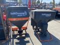 Two 2015 SaltDogg salt spreaders in black and orange with the SaltDogg logo prominently displayed on the side