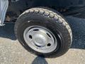 A close-up of a 2017 Ford F-250 SD wheel showcasing a silver rim and a black tire with a rugged tread pattern