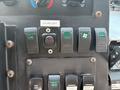 Control panel of a 2011 Workhorse W62 with various switches and buttons for functions like ceiling light heated mirrors and fan