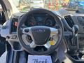 Steering wheel and dashboard of a 2016 Ford Transit 150 with controls and instrument panel visible