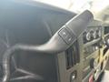 Close-up of a control lever inside a 2018 Chevrolet Express featuring buttons for adjusting settings
