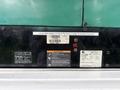 2011 Ford F-650 with visible labels and stickers including a warning section and maintenance information on the rear panel
