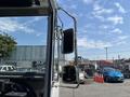 Side mirrors of a 2012 Ford Econoline showing chrome finish and two reflective surfaces