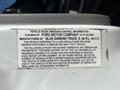 Label on a 2004 Ford F-750 describing vehicle noise emission control information and manufacturing details