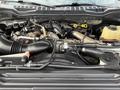The engine bay of a 2017 Ford F-350 SD with visible components like the air intake tube and various hoses and connectors