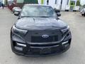 A black 2021 Ford Explorer is shown from the front view featuring a distinctive grille with the Ford logo and sleek LED headlights
