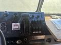 Interior dashboard controls of a 2009 Workhorse W62 featuring various levers gauges and switches