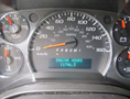 Dashboard of a 2011 Chevrolet Express showing the speedometer with a reading of 0 mph and engine hours displayed at 11746.5