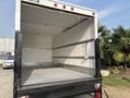 The image shows the open rear cargo area of a 2008 Ford Econoline box truck with a wooden floor and metal supports on the walls