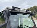 A 2019 Madvac LS175 with multiple LED light bars mounted on the roof and visible controls and dashboard inside the cab