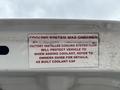 A label inside the hood of a 2020 Chevrolet Express detailing information about the cooling system and coolant specifications