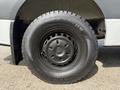 A close-up of the wheel of a 2021 Mercedes-Benz Sprinter featuring a black steel rim and a durable all-season tire