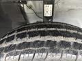 A close-up view of a tire with deep treads showing detail and texture on a 2023 RAM Promaster 3500