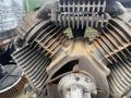 Close-up of a 2000 Baldor Air engine featuring large metal fins and a central housing with various mechanical components visible