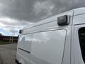 Close-up of a 2020 Mercedes-Benz Sprinter 2500 with a white exterior featuring a roof-mounted light on top of the cargo area