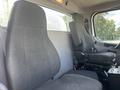 Interior seats of a 2022 Freightliner M2 106 truck with two gray upholstered seats positioned side by side