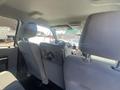 Interior view of a 2016 Ford F-350 SD showing the back seat and front dashboard with controls and display