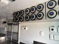 Interior view of a 2020 Freightliner MT45 showcasing a series of circular speakers mounted on the wall