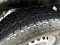 A close-up of a rugged tire with deep treads from a 2017 Mercedes-Benz Sprinter showcasing its traction and design