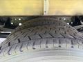 Close-up of a treaded tire from a 2018 Hino 195 showcasing detailed patterns and texture on the rubber surface
