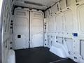 A 2020 Mercedes-Benz Sprinter with an empty cargo space featuring white walls and a flat floor