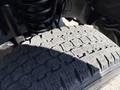 Close-up of the tire tread on a 2012 Ford F-350 SD showing detailed patterns and grooves