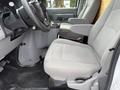 2022 Ford E-450 driver and passenger seats with grey fabric upholstery and a central console between them