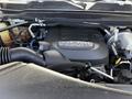 Close-up of a 2020 Ram 2500 engine showcasing the HEMI 64L badge with various components and hoses visible around the engine bay