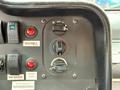 Dashboard controls of a 2012 Ford Econoline featuring a seatbelt indicator fan controls and warning lights