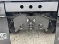 A 2013 Freightliner 114SD truck's rear hitch assembly with visible couplers and connections for towing