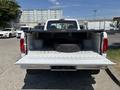 1995 Ford F-250 with an open truck bed containing a tire resting on the floor