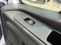 Close-up of a window control switch on the door panel of a 2022 Mercedes-Benz Sprinter