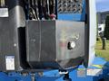 A 2012 Genie Z 45/25 lift with visible hydraulic components and control panel on the side