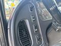 The image shows the interior dashboard controls of a 2014 Freightliner M2 106 including various buttons and a speedometer display