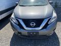 A 2017 Nissan Murano with a silver-gray exterior and a prominent front grille featuring the Nissan logo