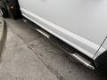 Close-up of the chrome running board on a 2020 Ford F-550 showcasing its sleek design and grip surface