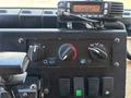 Dashboard controls of a 2008 Workhorse W62 featuring knobs switches and a mounted radio unit