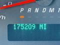 A 2014 Chevrolet Express dashboard displaying a digital odometer reading of 175209 miles