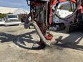 A 2018 Sandvik Ranger DX800 rock drilling rig featuring a long arm and a flexible hose extending downward from the front of the machine